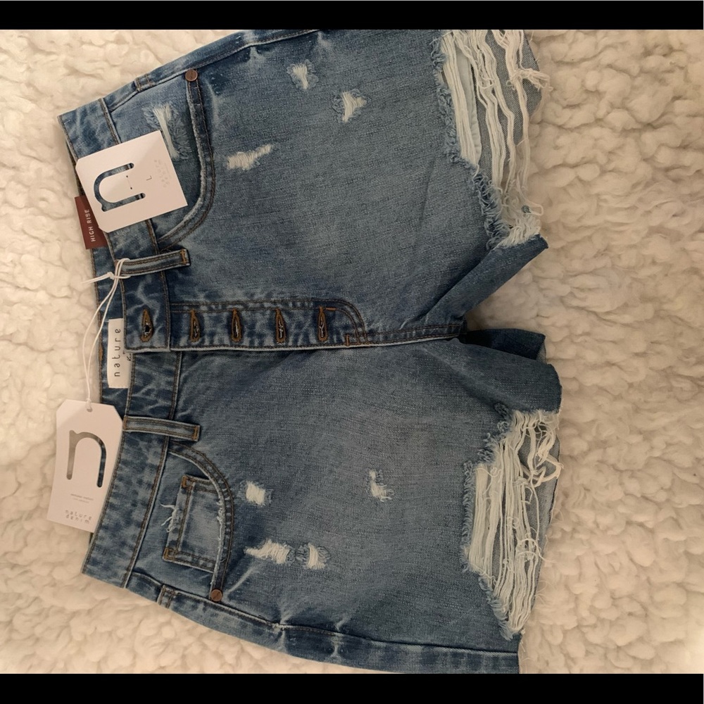 Distressed blue jean shorts